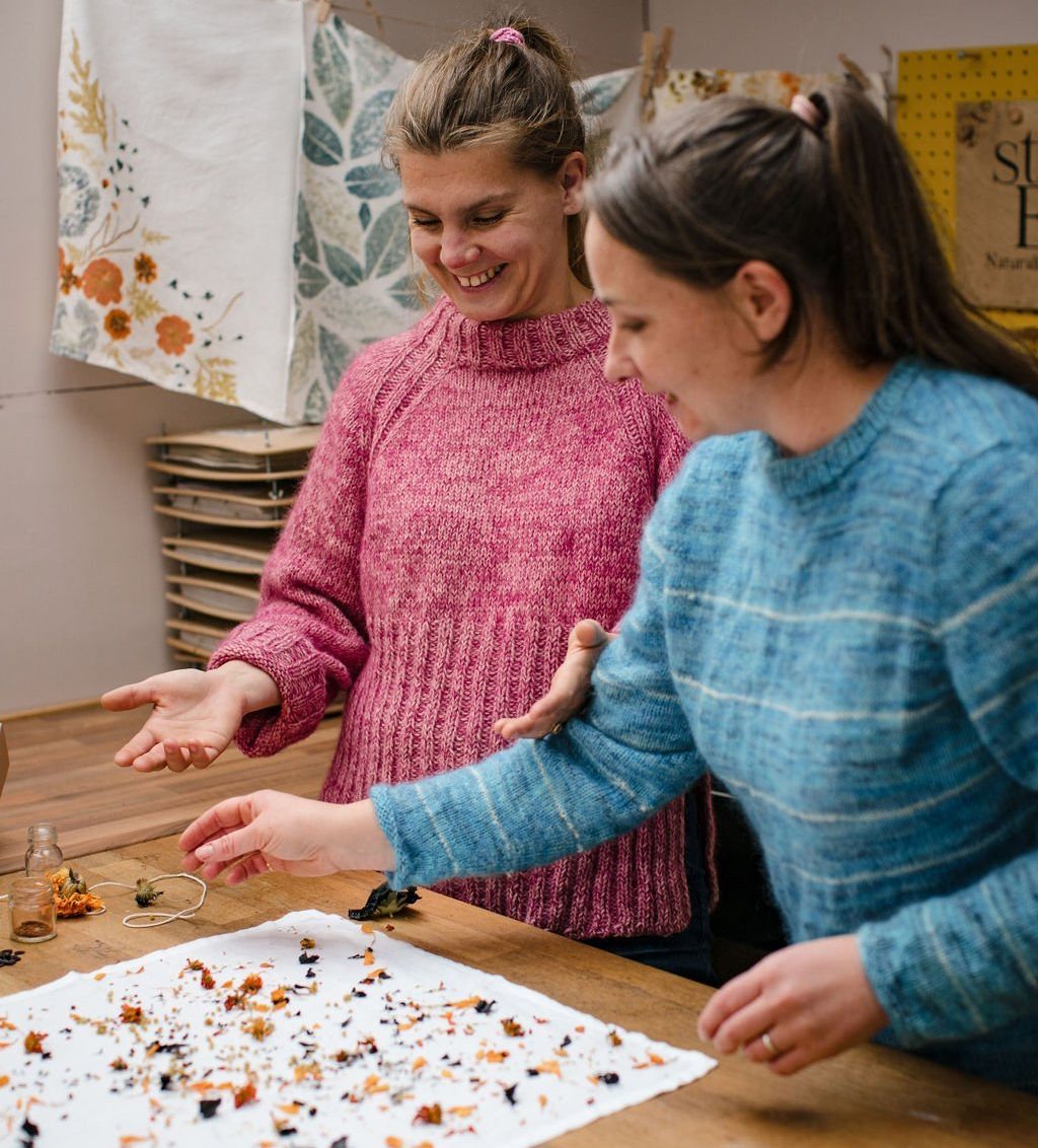 Content marketing for SEO with Claire and Stephy from natural dye business StudioEVIG. Image of Claire and Stephy preparing dye with flowers.