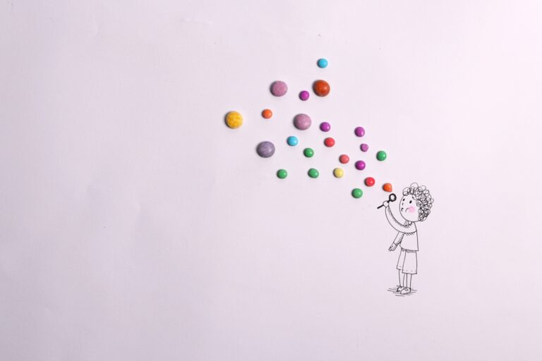 Don't panic! A straight forward guide to SEO in the age of AI - line drawing of a girl blowing multi-coloured bubbles made of coloured sweets