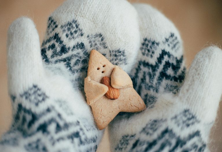 Digital marketing support in the form of a festive marketing checklist for small businesses - image of a cute star-shaped cookie hugging an almond nestling on a pair of mittens. Yes, it's as adorable as it sounds!
