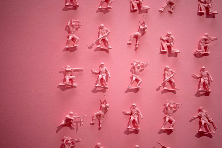 New year marketing planning for small businesses - image of pink toy soldiers on a pink background
